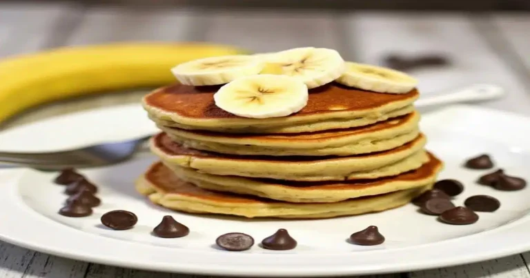 Stack of banana chocolate chip pancakes with maple syrup