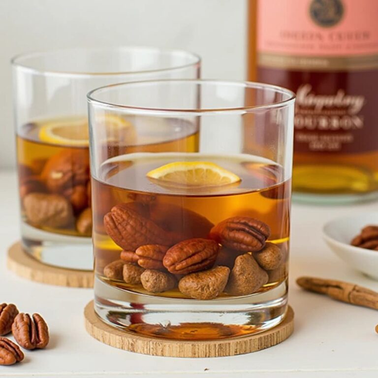 Glass of bourbon infused with pecans and cayenne pepper