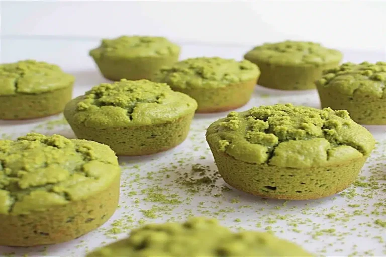 Freshly baked matcha muffins made with almond flour on a cooling rack