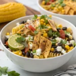 Creamy elote pasta salad with fresh corn and cotija cheese.