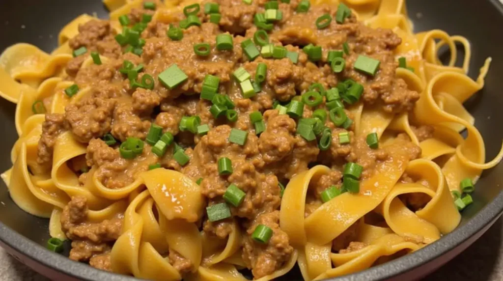 Italian drunken noodles with ground beef, closeup view.