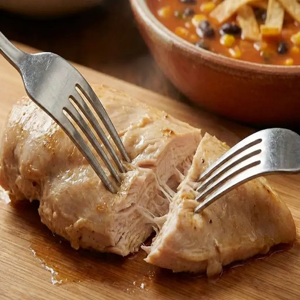 Crockpot Chicken Tortilla Soup: Your Coziest Set-It-And-Forget-It Meal 8 shredding-cooked-chicken-for-tortilla-soup