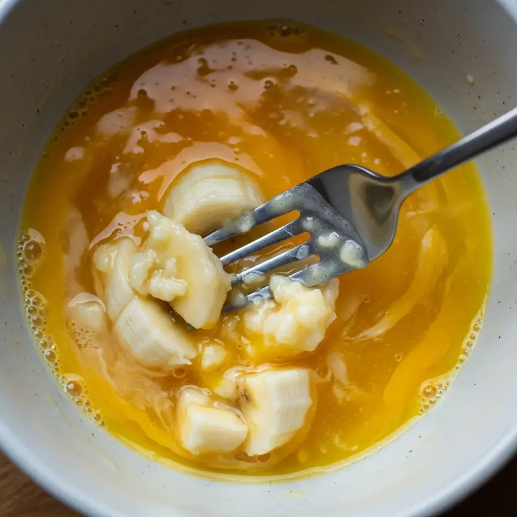 3 Ingredient Oatmeal Cookies With Egg 9 mashing banana and egg for cookie dough